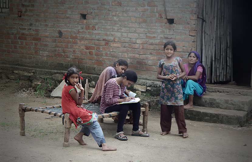 Gujarat, India - June, 2015: A girl conducting survey in an all girl household in a tribal village. (Source: Shutterstock)