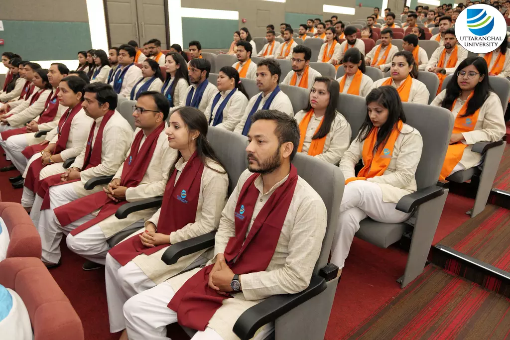 Students can be seen wearing maroon, saffron and blue scarves in the picture