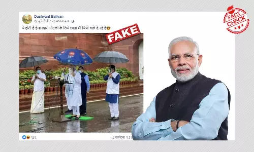 Photo Of PM Modi Holding A Jio Umbrella Is Satire