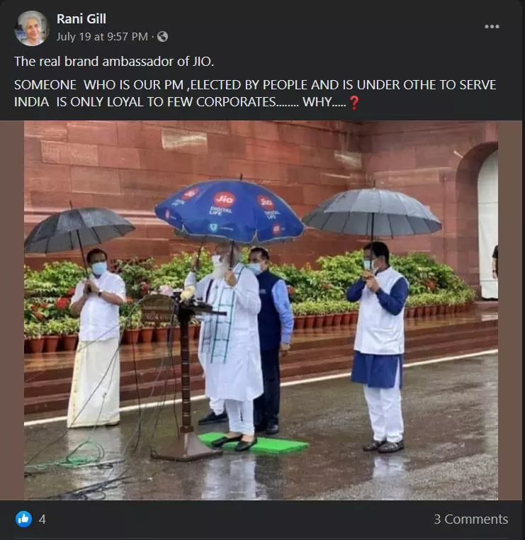 Photo Of PM Modi Holding A Jio Umbrella Is Satire