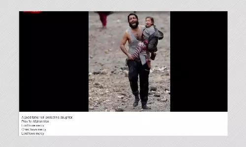 2017 Photo Of Man Carrying Daughter In War-Hit Mosul Shared As Afghanistan