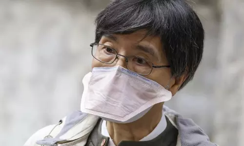 Image Of Woman Wearing Multiple Masks Is From 2019, A Year Before Pandemic