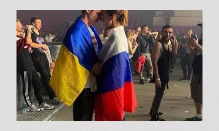 2019 Photo Of Couple Draped In Russian and Ukrainian Flags Shared As Recent