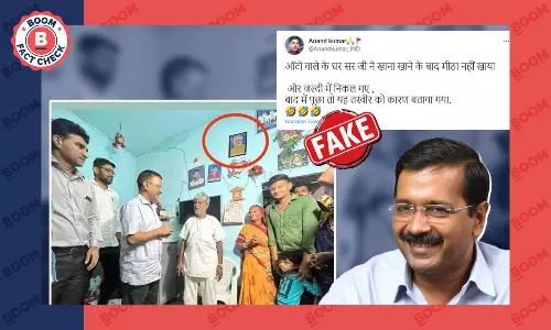 Image Of PM Modis Photo On Wall During Kejriwals Visit To Auto Drivers House Is Morphed