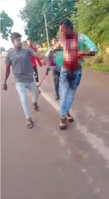 Screenshot of a video showing a murder in Savanur, Karnataka Screenshot of a video showing a murder in Savanur, Karnataka