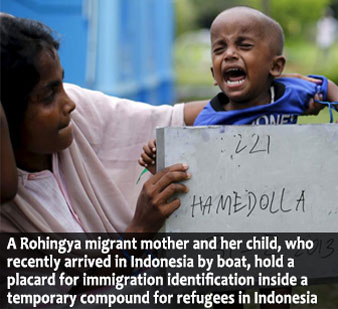 Migrants believed to be Rohingya rest inside a shelter after being rescued from boats at Lhoksukon in Indonesia's Aceh Province. (Source: REUTERS/Roni Bintang)