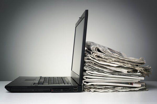 laptop-newspapers