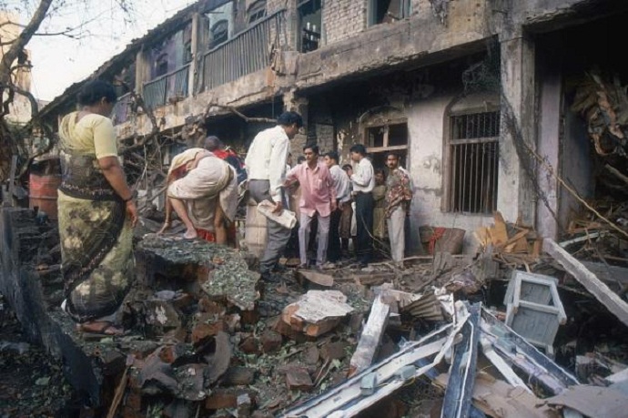 Onlookers at a bomb blast site in Mumbai