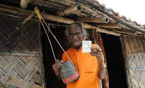 Image shoes an Indian voter with his voter ID