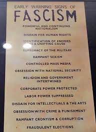 Image shows The poster on early warning signs of fascism at the US Holocaust Memorial.