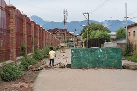 A kid crosses a barricade Soura, Srinagar