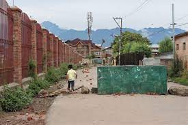 A kid crosses a barricade Soura, Srinagar