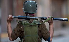 A soldier standing with a gun in Jammu and Kashmir