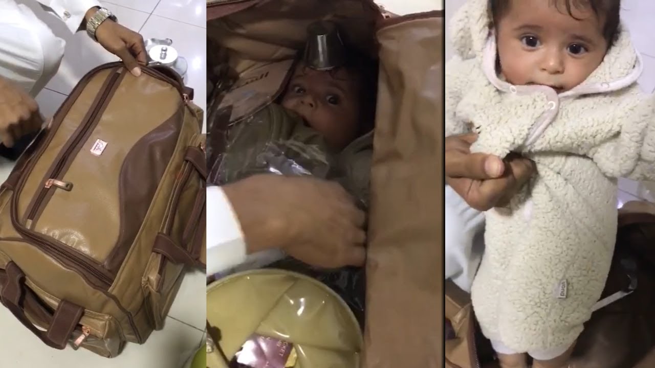 baby in bag old video